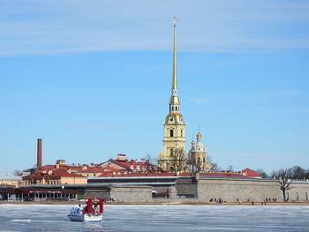 View of temple building against sky and hovercraft