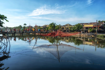 Thu bon river and an hoi town reflection taken from hoi an ancient town river bank.