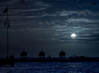 View of boats in sea at night