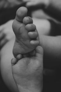 Close-up of hand holding baby