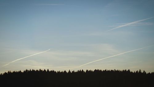 Panoramic view of vapor trails in sky