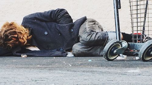 High angle view of man lying on floor