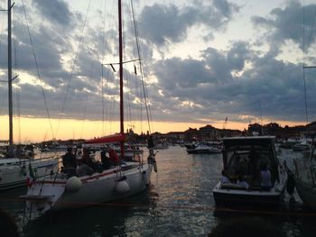 Boats moored at harbor