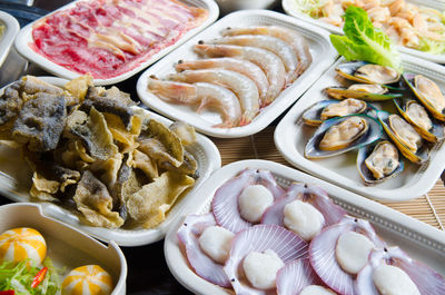 Close-up of seafood in plates on table