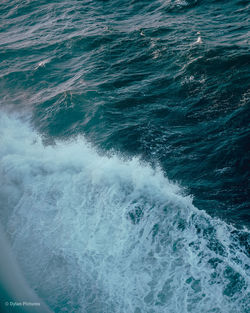 High angle view of water splashing in sea