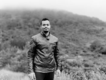 Portrait of young man standing outdoors