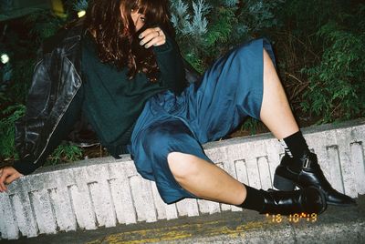 Low section of woman sitting on floor