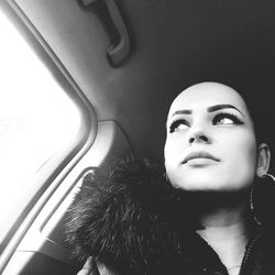 Portrait of a young woman in car