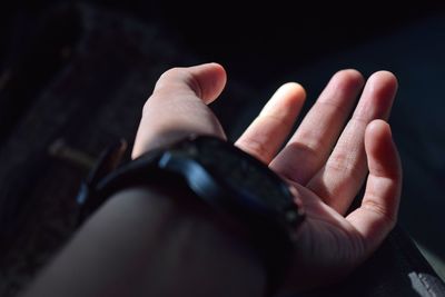 Cropped image of hand wearing wristwatch