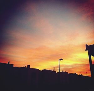 Silhouette of built structure at sunset