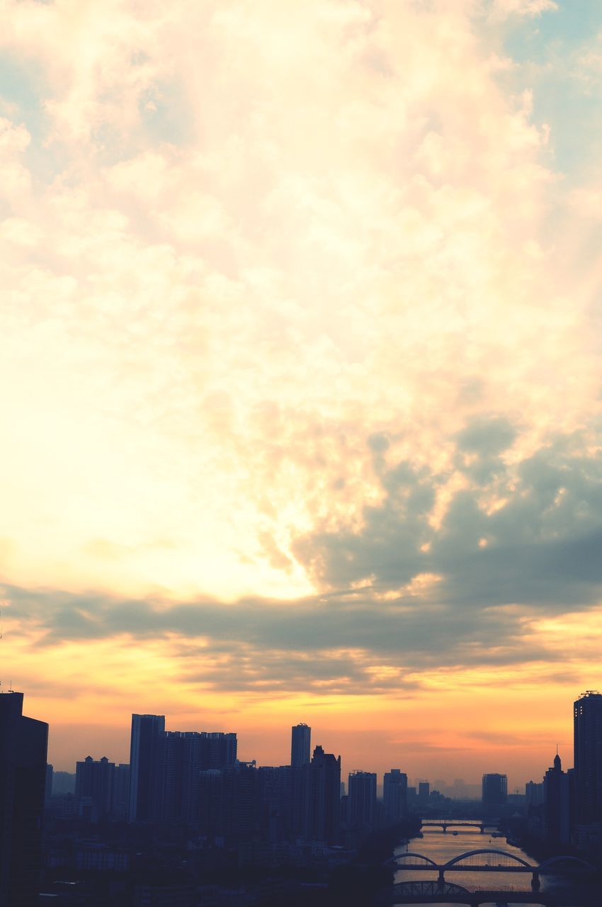 sunset, building exterior, architecture, built structure, city, sky, cityscape, orange color, silhouette, cloud - sky, cloud, skyscraper, residential building, city life, skyline, dramatic sky, outdoors, residential district, cloudy, building