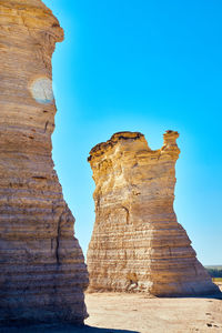 Rock formations against blue sky