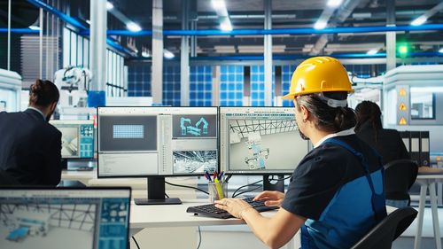 Rear view of engineer working at construction site