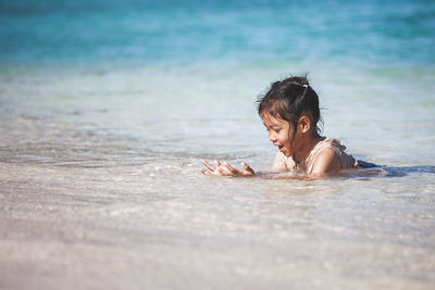 Girl lying in sea