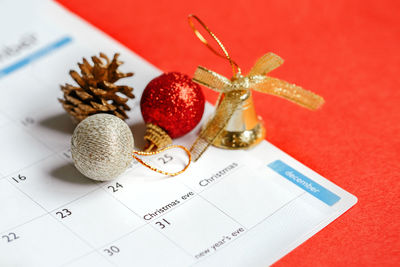 Page of planner calendar opened on december 24 christmas holiday. flat lay calendar with toys