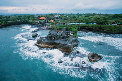 Scenic view of sea against cloudy sky