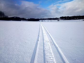 View of road against cloudy sky