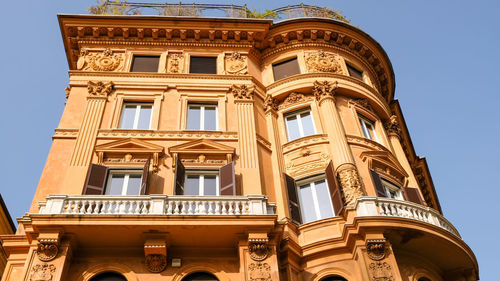 Low angle view of historical building against blue sky