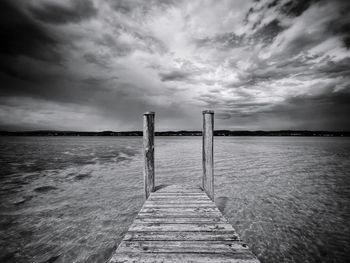 Pier over sea against sky
