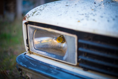 Close-up of abandoned car outdoors