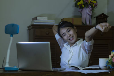 Girl sitting on table at home