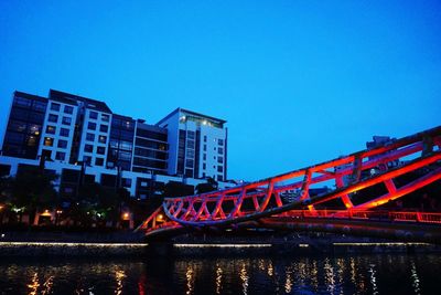 Low angle view of bridge against clear blue sky