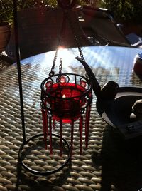 Close-up of red metal hanging outdoors