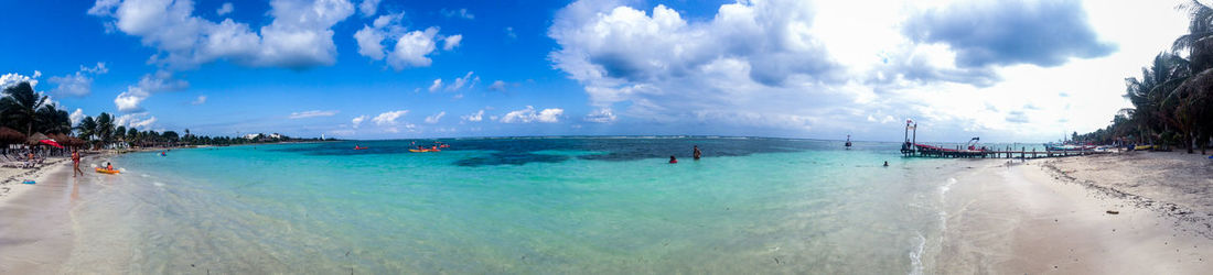 Panoramic view of beach against cloudy sky