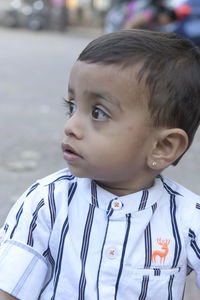 Portrait of cute boy looking away