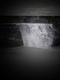 View of waterfall against the wall