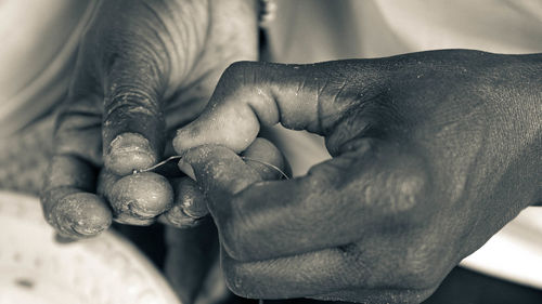 Close-up of man holding hands