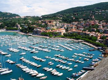 High angle view of harbor by buildings in city