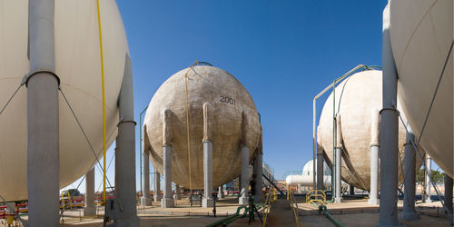 Low angle view of modern building against blue sky