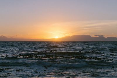 Scenic view of sea against sky during sunset