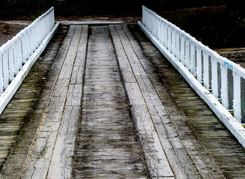 Footbridge amidst stone wall