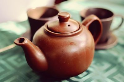 Close-up of tea pot on table