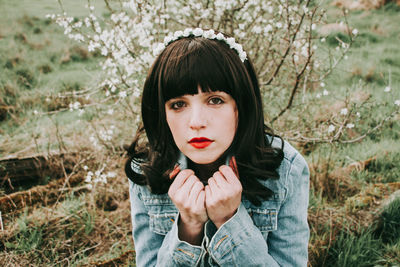 Portrait of woman on field