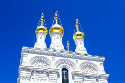 Low angle view of a building against blue sky