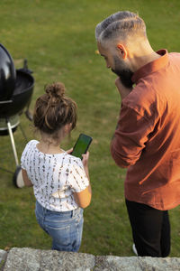 Father with daughter in park