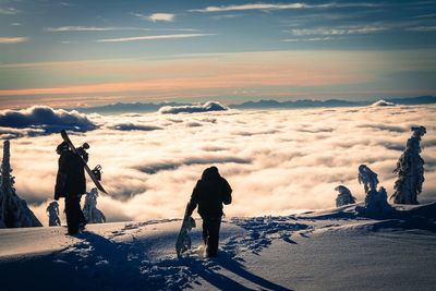 Rear view of man hiking on mountain