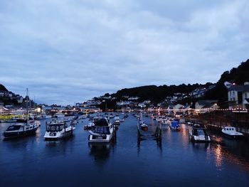 Boats moored at harbor