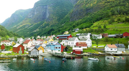 Houses by river in town