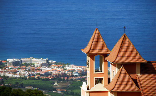 High angle view of cityscape against clear blue sky