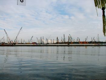 Scenic view of harbor against sky