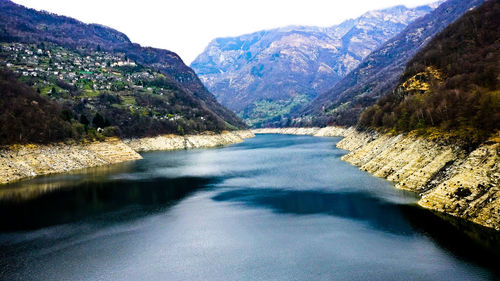 Scenic view of lake and mountains against sky