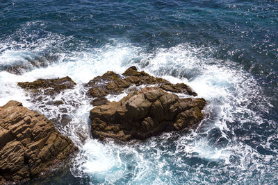 Waves splashing on rocks