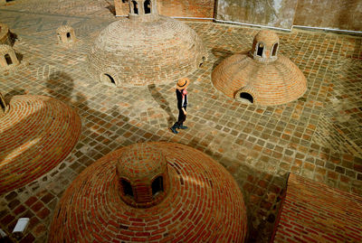 High angle view of man walking on wall