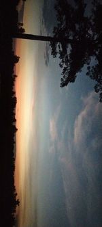 Scenic view of lake against sky at sunset