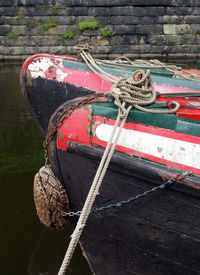 Rope tied up on boat moored at harbor