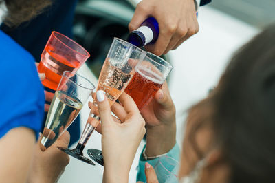 People holding wineglasses